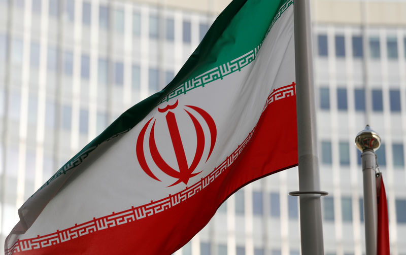 © Reuters. FILE PHOTO: The Iranian flag flutters in front the International Atomic Energy Agency (IAEA) headquarters in Vienna
