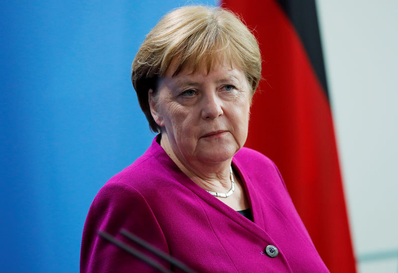 © Reuters. FILE PHOTO: German Chancellor Merkel looks on as she attends a news conference at the Chancellery in Berlin