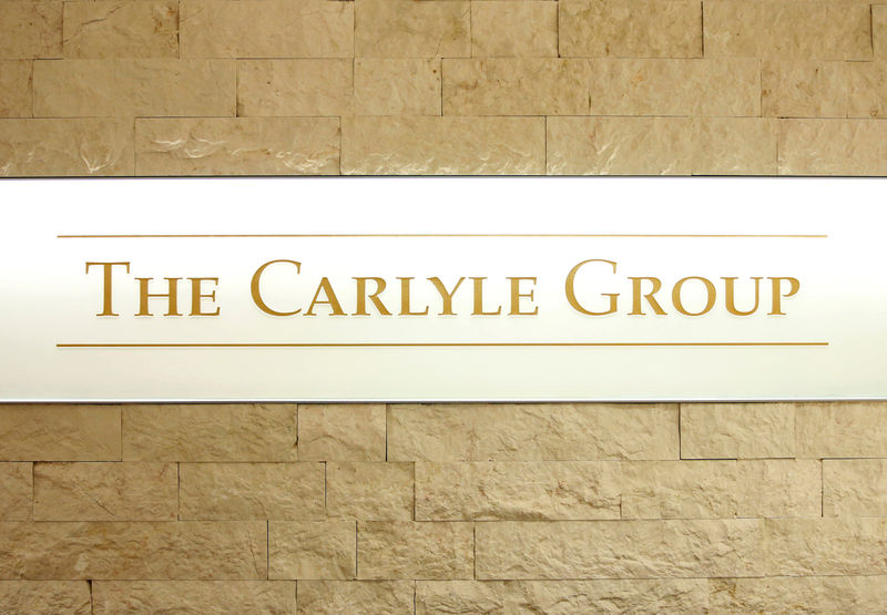© Reuters. The logo of The Carlyle Group is displayed at the company's office in Tokyo