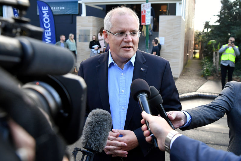 © Reuters. Australian Prime Minister Morrison speaks to the media as he arrives at the Horizon Church in Sutherland