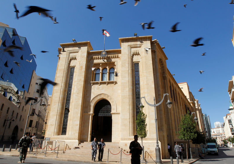 © Reuters. Lebanese policeman stand outside the parliament building in downtown Beirut