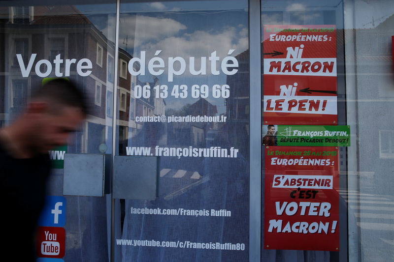 © Reuters. A man walks past the local headquarters of Francois Ruffin, a member of parliament of political party " La France Insoumise" (France Unbowed), in Amiens