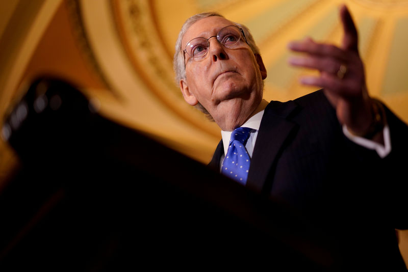 © Reuters. FILE PHOTO - Senate Majority Leader Mitch McConnell speaks with reporters following the weekly policy luncheons on Capitol Hill