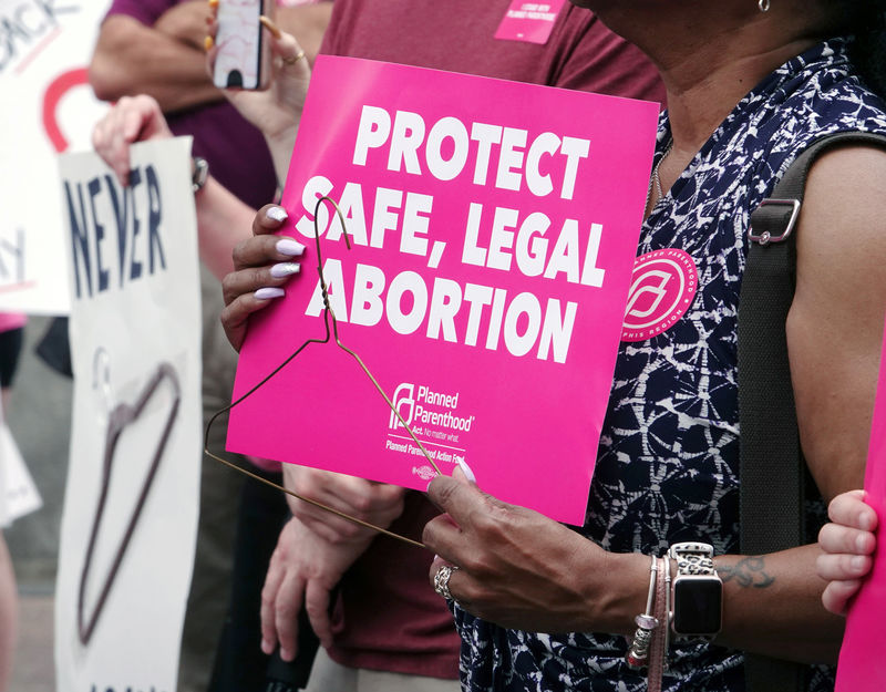 © Reuters. A pro-choice activist holds a sign in downtown Memphis during a "Stop Abortion Bans Day of Action" rally hosted by the Tennessee chapter of Planned Parenthood in Tennessee