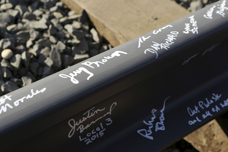 © Reuters. FILE PHOTO - California Governor Jerry Brown's name and others are pictured on a railroad rail after a ceremony for the California High Speed Rail in Fresno, California January 6, 2015.