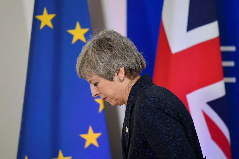 © Reuters. FILE PHOTO: Britain's PM Theresa May leaves after giving a news briefing in Brussels
