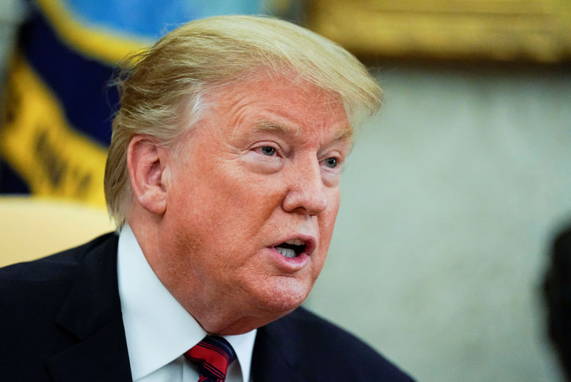 © Reuters. FILE PHOTO - President Trump talks to reporters at the White House in Washington