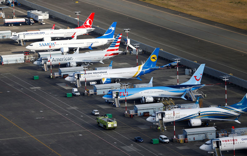 © Reuters. FILE PHOTO: An aerial photo shows several Boeing 737 MAX airplanes grounded at Boeing Field in Seattle