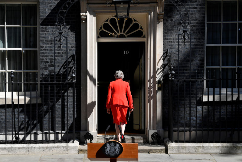 © Reuters. British Prime Minister Theresa May leaves after delivering a statement in London