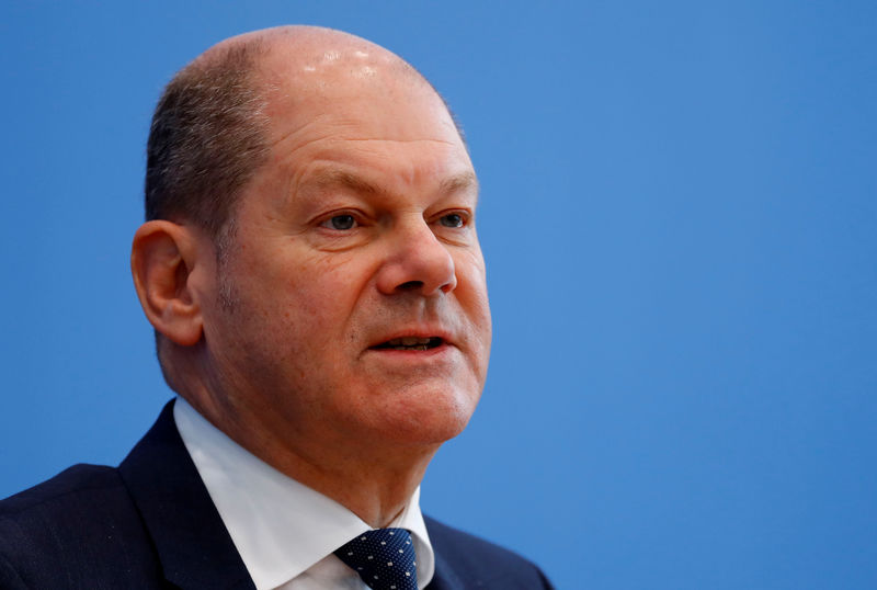© Reuters. Finance Minister Olaf Scholz addresses a news conference to present the budget plans for 2019 and the upcoming years in Berlin