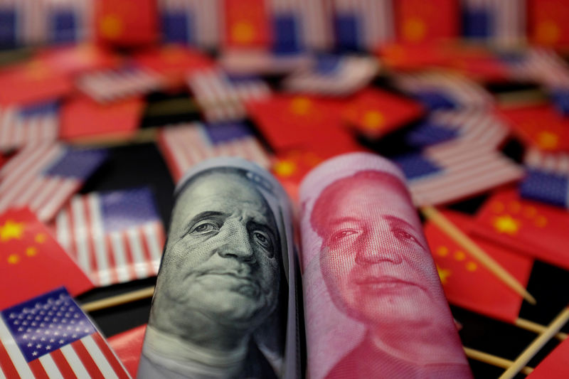 © Reuters. Illustration picture showing U.S. dollar and China's yuan banknotes