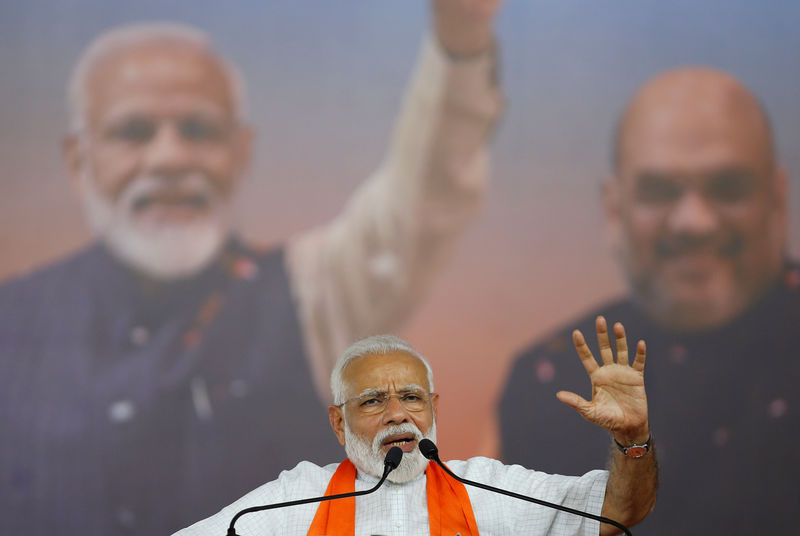 © Reuters. India's Prime Minister Narendra Modi gestures as he addresses his supporters during a public meeting in Ahmedabad