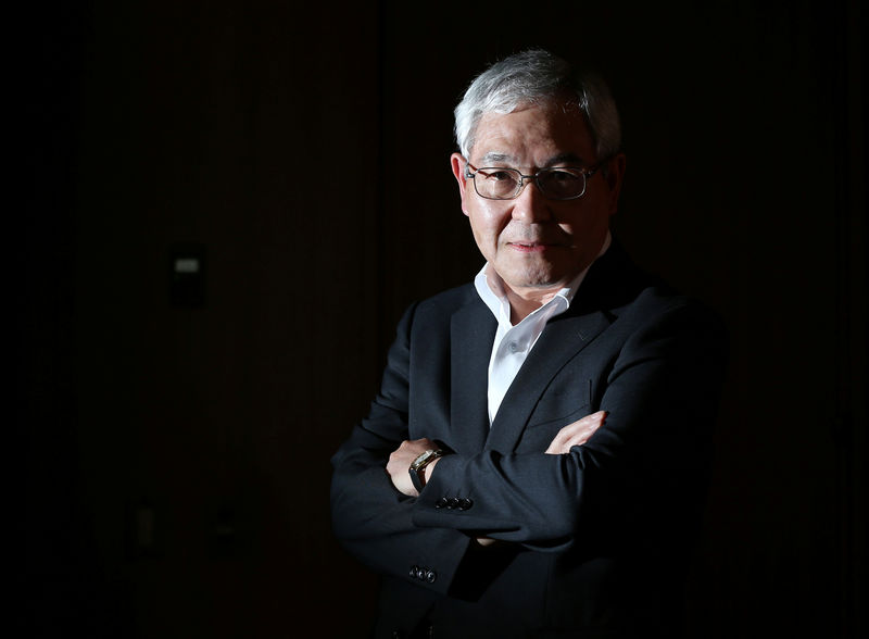 © Reuters. BOJ board member Sakurai poses for a photo after an interview with Reuters at the BOJ headquarters in Tokyo