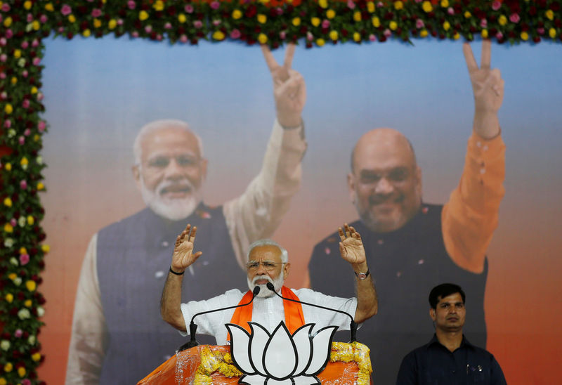 © Reuters. India's Prime Minister Narendra Modi gestures as he addresses his supporters during a public meeting in Ahmedabad