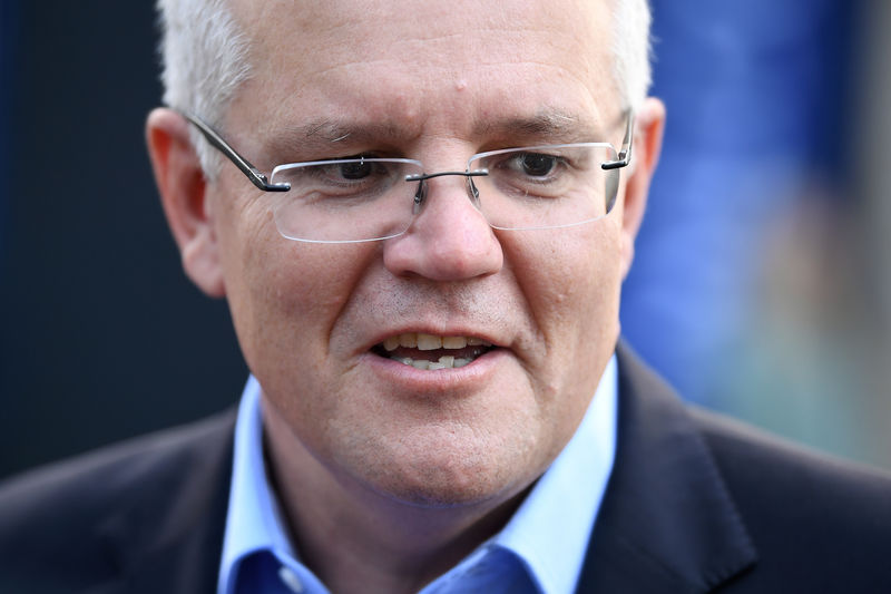 © Reuters. FILE PHOTO: Prime Minister Scott Morrison speaks to the media as he arrives at the Horizon Church in Sutherland in Sydney