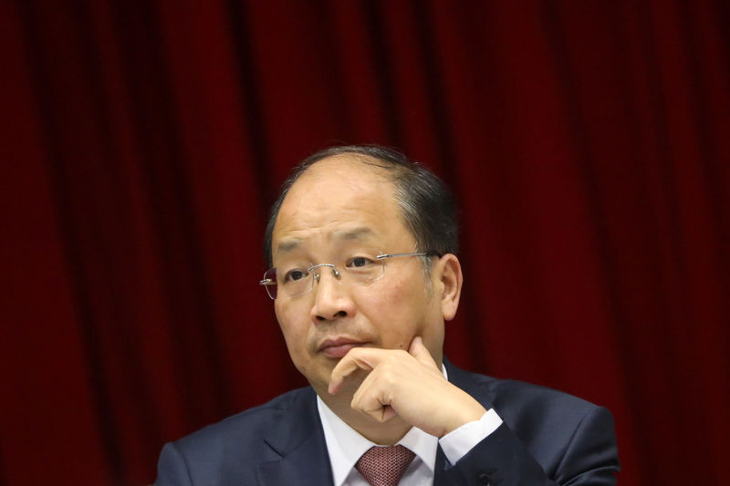 © Reuters. Yi Huiman, chairman of China Securities Regulatory Commission, attends a meeting of Fujian delegation on the sidelines of the National People's Congress (NPC), at the Great Hall of the People in Beijing