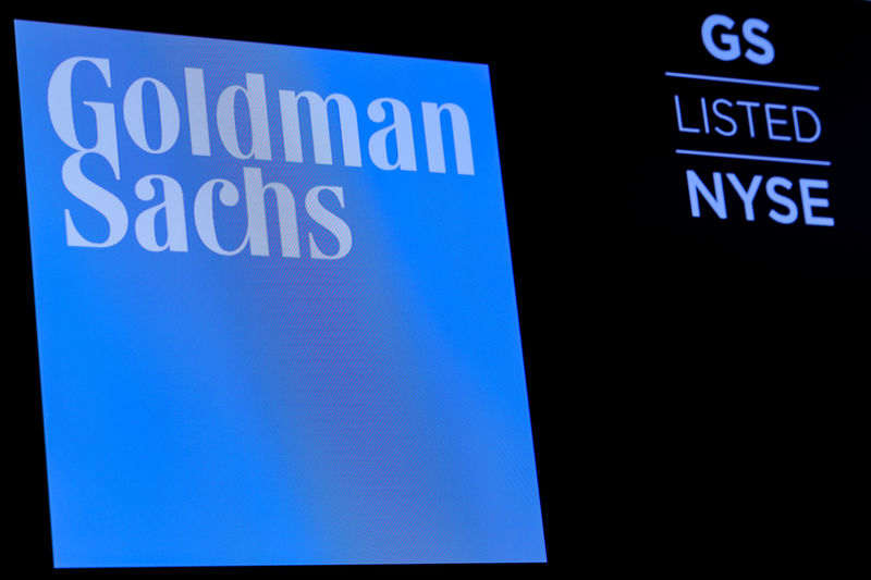 © Reuters. FILE PHOTO: The ticker symbol and logo for Goldman Sachs on a screen on the floor at the NYSE in New York