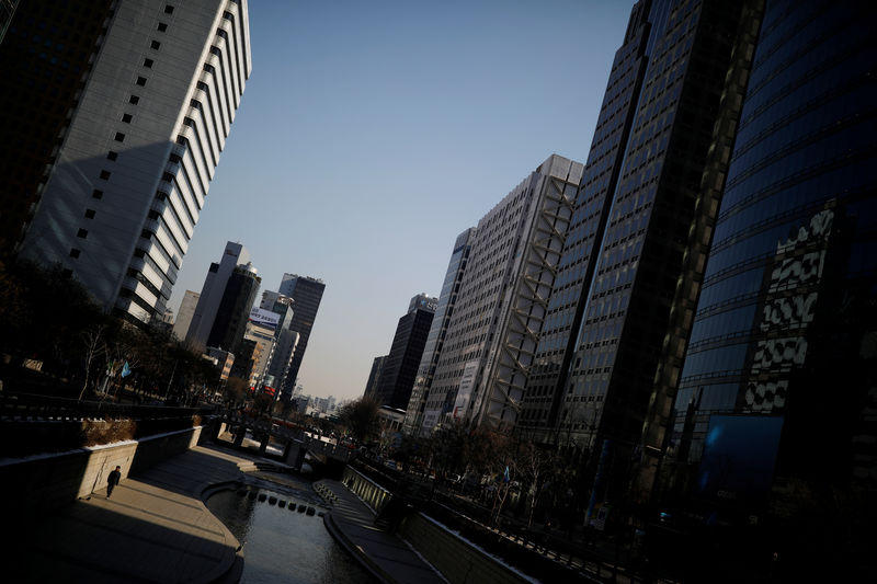 © Reuters. A man walks along the Cheonggye stream in central Seoul