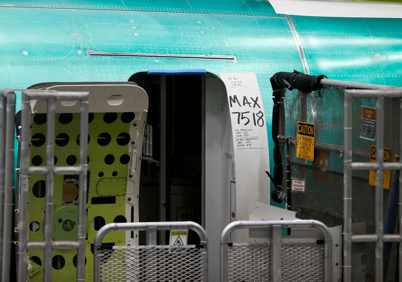 © Reuters. FILE PHOTO: A door of a 737 Max aircraft with production notes is seen at the Boeing factory in Renton