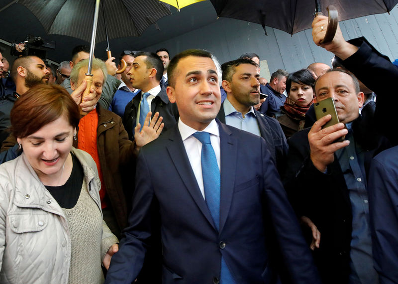 © Reuters. FILE PHOTO: Italian Deputy Prime Minister and 5-Star Movement leader Luigi Di Maio leaves after casting his vote in the European election