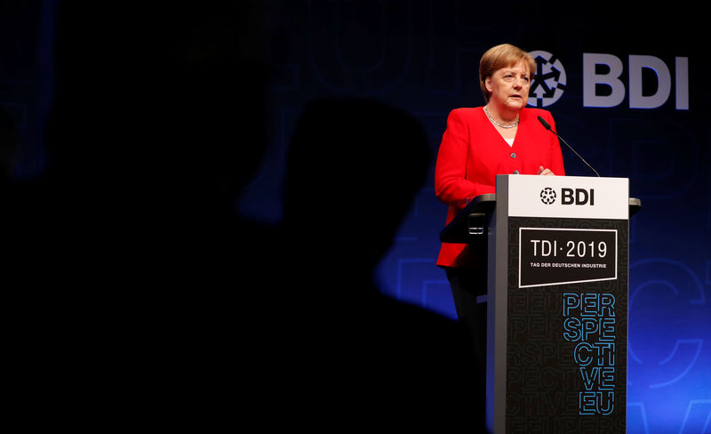 © Reuters. German Chancellor Angela Merkel addresses the German Industry Day conference in Berlin