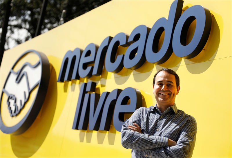 © Reuters. Stelleo Tolda ao lado de logo do Mercado Livre