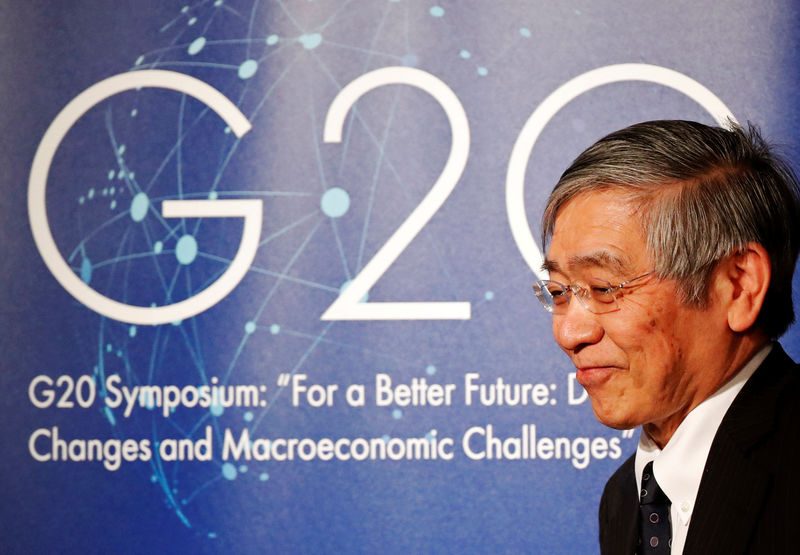 © Reuters. Bank of Japan Governor Haruhiko Kuroda attends a G20 symposium on demographic change in Tokyo