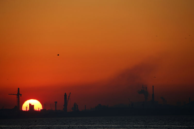 © Reuters. Dunkirk port industries are seen during sunset, in Leffrinckouke