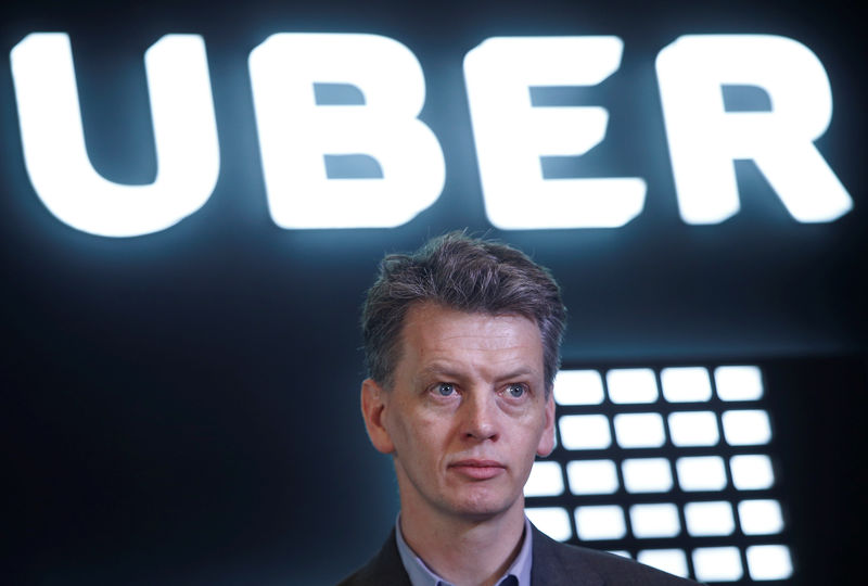 © Reuters. Barney Harford, COO of Uber listens to a question during a news conference in New Delhi