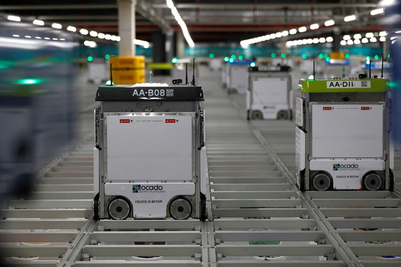 © Reuters. FILE PHOTO: "Bots" are seen on the grid of the "smart platform" at the Ocado CFC (Customer Fulfilment Centre) in Andover