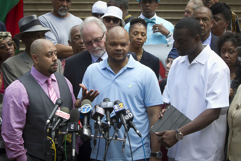 © Reuters. FILE PHOTO - Wrongly convicted "Central Park Five" members Santana, Richardson and Salaam attend a news conference announcing the payout for the case at City Hall in New York