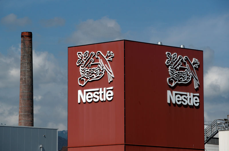 © Reuters. FILE PHOTO: A Nestle logo is pictured on a coffee factory in Orbe