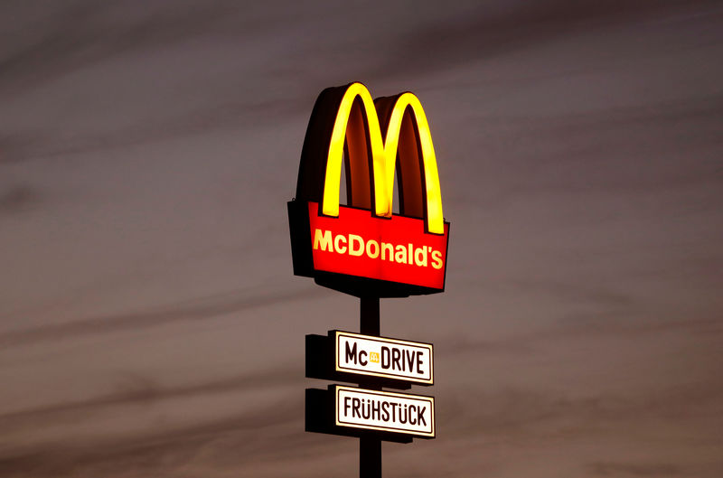 © Reuters. FILE PHOTO - A huge advertisement for a branch of fastfood giant McDonald's is seen on the outskirts of Berlin