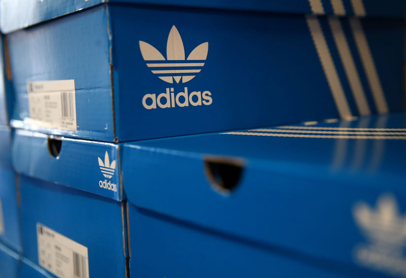 © Reuters. Boxes of Adidas shoes are pictured in the warehouse of local footwear retailer "Pomp It Up" in Bussigny