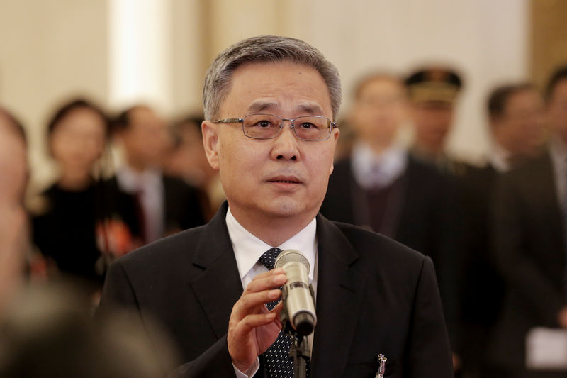 © Reuters. China's top banking regulator Guo Shuqing speaks to reporters on the sidelines of the National People's Congress (NPC) at the Great Hall of the People in Beijing