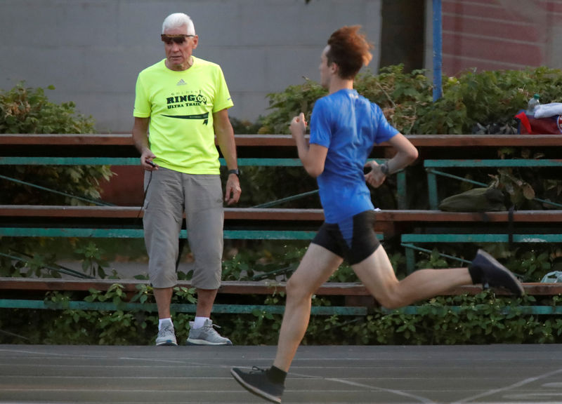 © Reuters. FILE PHOTO: Banned Russian athletics coach Valery Volkov runs a training session at a university track in Moscow