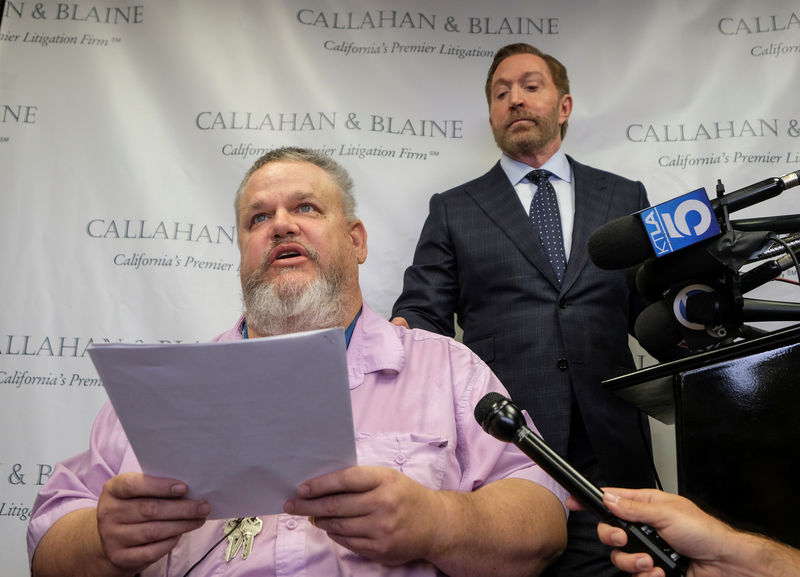 © Reuters. Geoffrey Johnson and his attorney Daniel J. Callahan speak in a news conference announcing a lawsuit against his former lawyer Michael Avenatti over a 4 million dollar settlement with the County of Los Angeles in Santa Ana