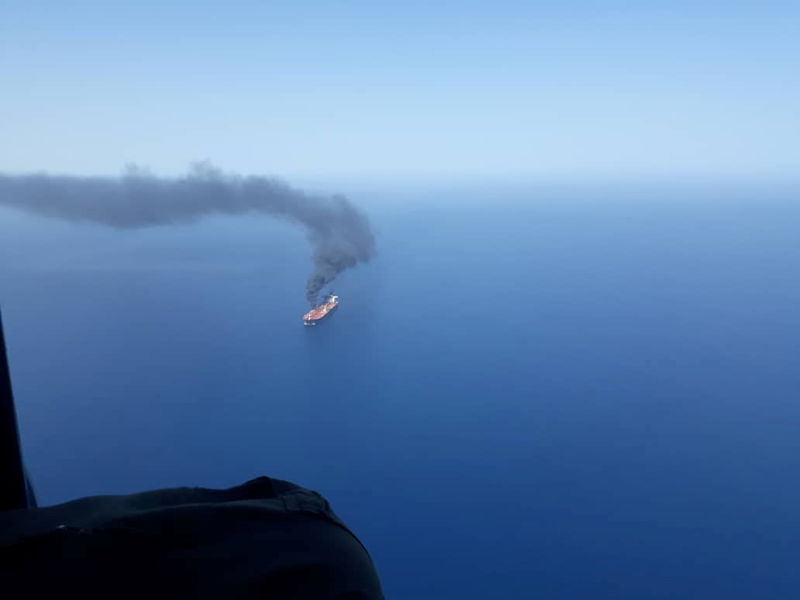 © Reuters. An oil tanker is seen after it was attacked in the Gulf of Oman