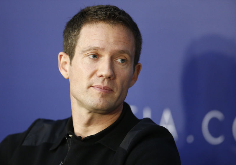 © Reuters. FILE PHOTO - World Rally Champion Ogier listens during the FIA news conference in St. Petersburg