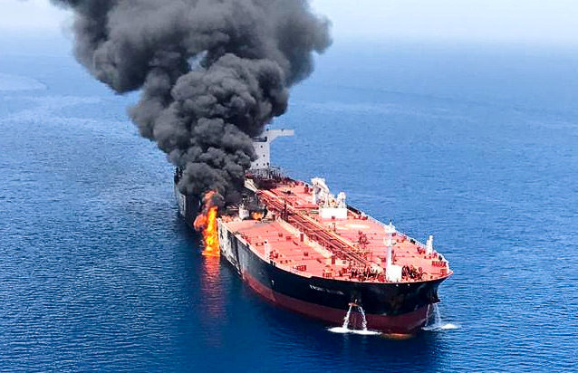 © Reuters. An oil tanker is seen after it was attacked at the Gulf of Oman