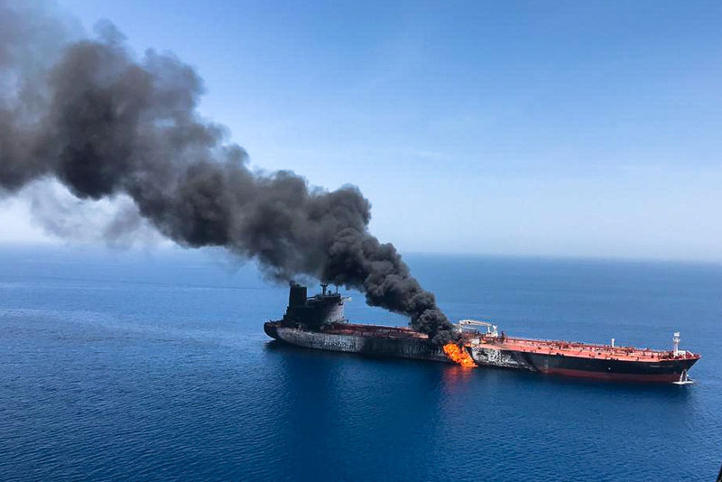 © Reuters. An oil tanker is seen after it was attacked at the Gulf of Oman