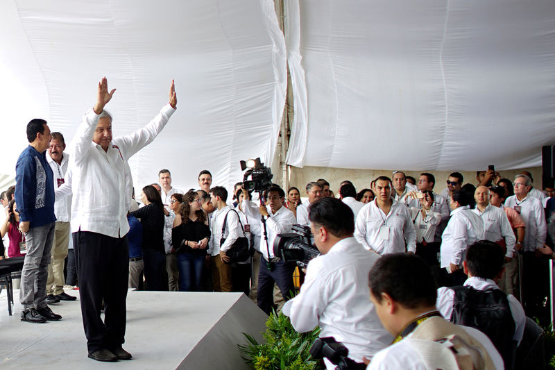 © Reuters. FILE PHOTO: Mexico's new President Andres Manuel Lopez Obrador waves to the public as he arrives for an event to unveil his plan for oil refining in Paraiso Tabasco state