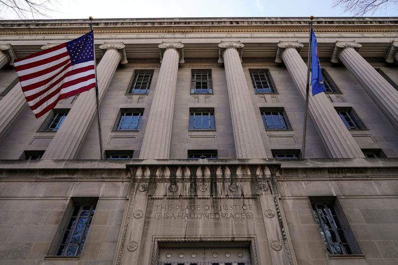 © Reuters. FILE PHOTO: A flag flies from the Department of Justice in Washington