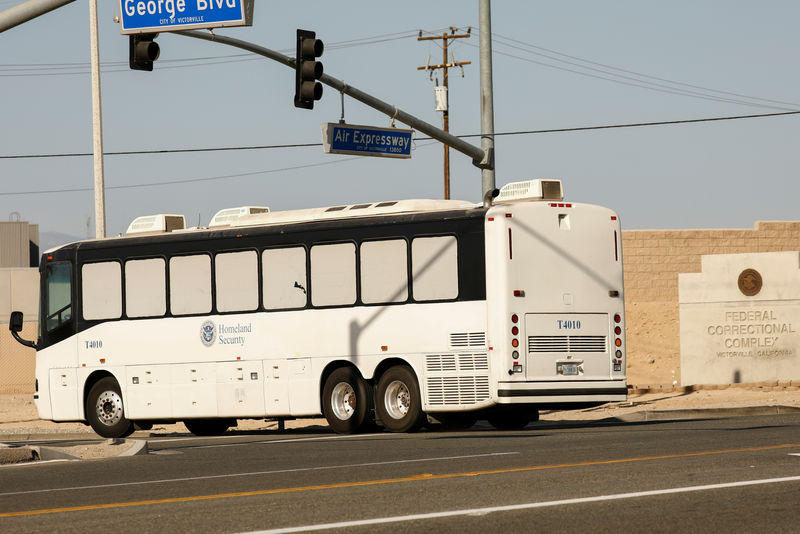 © Reuters. Immigration and Customs Enforcement (ICE) detainees arrive at FCI Victorville federal prison in Victorville