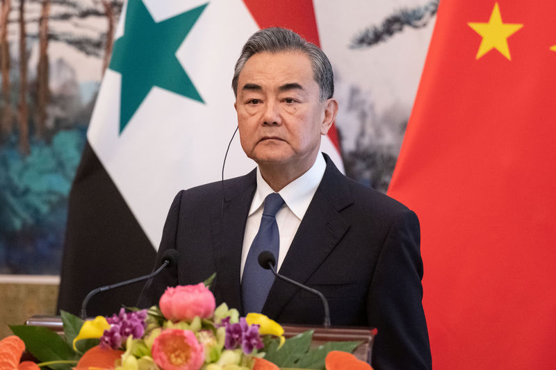 © Reuters. Chinese Foreign Minister Wang Yi speaks to journalists after a meeting with Syrian Foreign Minister Walid Muallem at Diaoyutai state guesthouse in Beijing