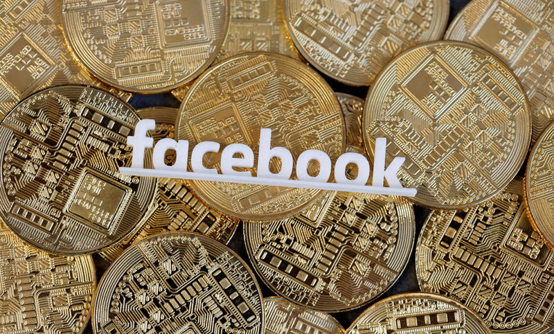 © Reuters. Facebook logo is seen on representations of virtual currency in this illustration picture