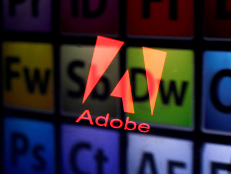 © Reuters. FILE PHOTO: Picture illustration shows Adobe logo and Adobe products reflected on a monitor display and an iPad screen, in central Bosnian town of Zenica