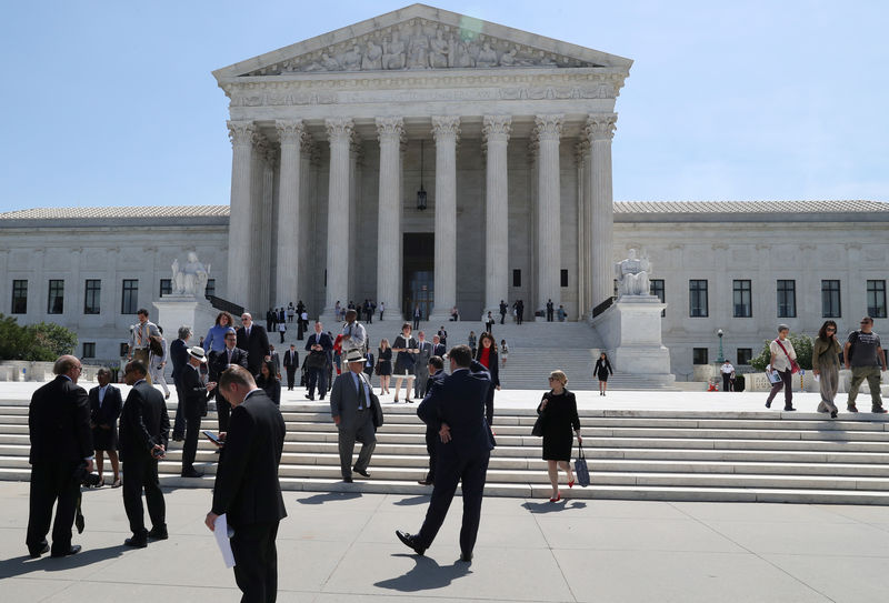 © Reuters. People exit and stand outside of the U.S. Supreme Court in Washington