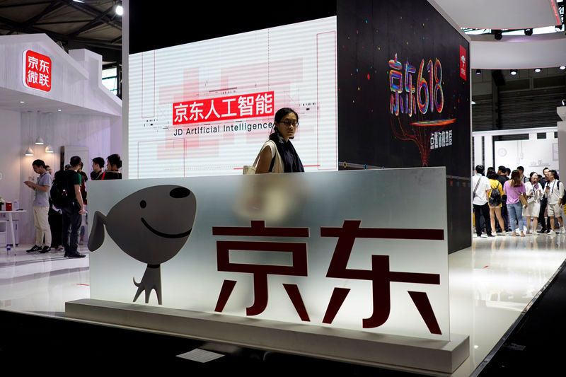 © Reuters. FILE PHOTO: A sign of China's e-commerce company JD.com is seen at CES (Consumer Electronics Show) Asia 2018 in Shanghai