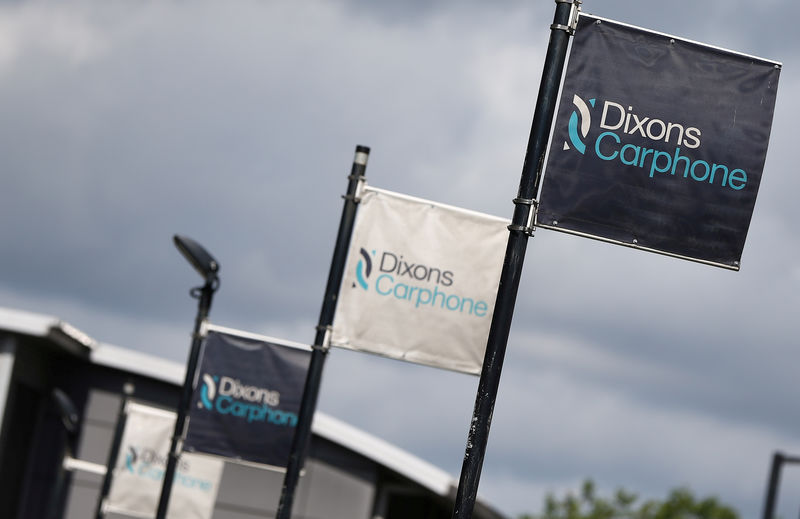 © Reuters. FILE PHOTO: Signs display the logo of Dixons Carphone at the company headquarters in London